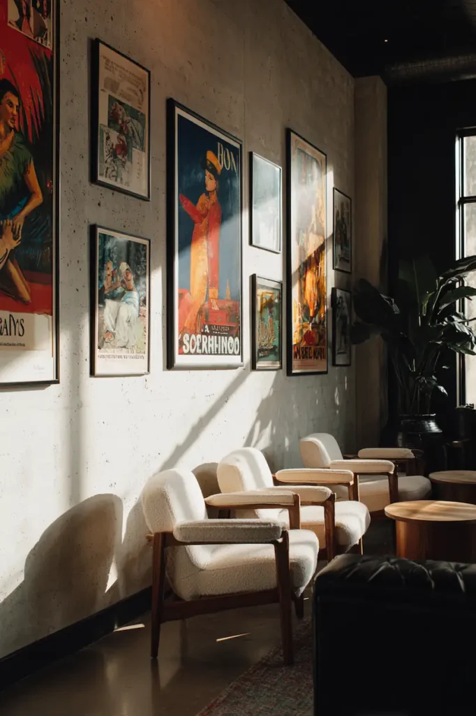 Vintage posters adding warmth and character to a modern interior wall.